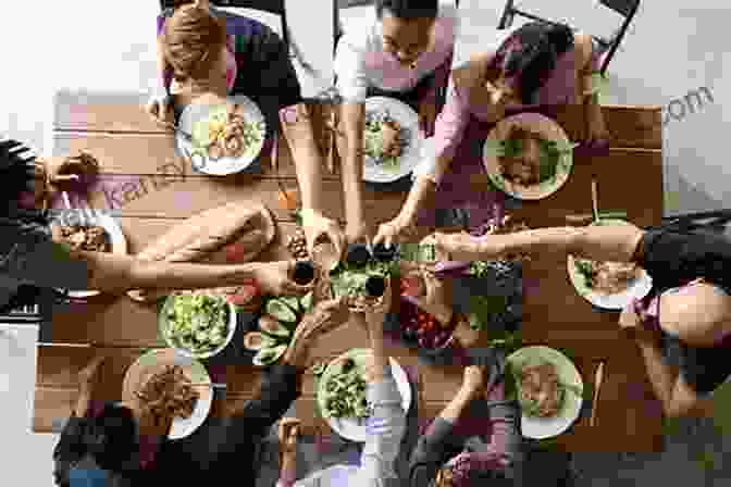 Image Of A Group Of People Sharing A Meal And Laughing The Cost Of My Faith: How A Decision In My Cake Shop Took Me To The Supreme Court